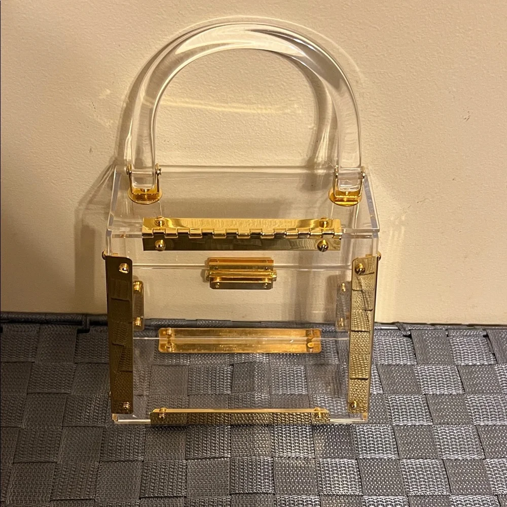 Elegant Clear Handbag with Gold Accents - Picture 2 of 5